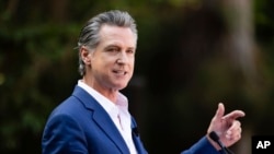 FILE - California Governor Gavin Newsom, shown here at the San Diego Zoo on Aug. 8, 2024, signed a law on Sept. 20, 2024, that outlaws social media platforms from knowingly providing addictive feeds to children without parental consent.