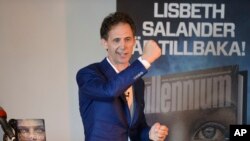 FILE - David Lagercrantz talks to media at a release event for the fourth book in the Millenium series of crime novels in Stockholm, Aug. 26, 2015.