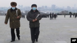 FILE - North Koreans visit and pay respect to the statues of late leaders Kim Il Sung and Kim Jong Il on Mansu Hill in Pyongyang, North Korea Sunday, Jan. 22, 2023 on the occasion of the Lunar New Year. 