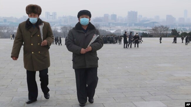 FILE - North Koreans visit and pay respect to the statues of late leaders Kim Il Sung and Kim Jong Il on Mansu Hill in Pyongyang, North Korea Sunday, Jan. 22, 2023 on the occasion of the Lunar New Year.