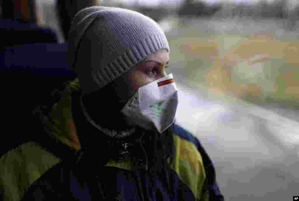 A Ukrainian tourist visits the site of Chernobyl. For the first time in 25 years, official tours are being formed. (VOA Photo/D. Markosian)