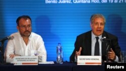 Mexico's Foreign Minister Luis Videgaray (L) and Organization of American States (OAS) Secretary General Luis Almagro hold a news conference ahead of the OAS 47th General Assembly in Cancun, Mexico, June 19, 2017. 