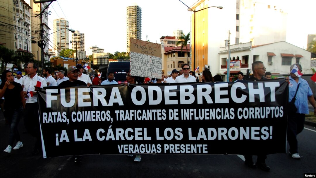 People take part in a march against the Brazilian construction firm Odebrecht in Panama City, Panama, Jan. 25, 2017. The banner reads "Get Out Odebrecht, Jail for the thieves." 