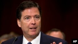 FILE - FBI Director nominee James Comey testifies on Capitol Hill in Washington, July 9, 2013. 