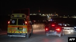 An ambulance arrives at the site of a drone strike near the northern Israeli town of Binyamina, Oct. 13, 2024, amid the continuing war between Israel and Hezbollah.