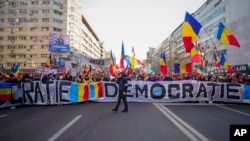 Protesters are seen during a rally organized by the right-wing Alliance for the Unity of Romanians (AUR), calling for free elections, in Bucharest, Jan. 12, 2025.