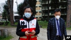 FILE - Sun Shuopeng, vice president of China's Red Cross, leaves after a news conference with Italian Foreign Minister Luigi Di Maio in Rome, March 13, 2020. Italy has welcomed Chinese experts and 31 tons of equipment to aid in the coronavirus fight.
