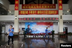 FILE - An image of Chinese President Xi Jinping is seen inside a building at the Wenchang Space Launch Center, in Hainan province, China, Nov. 23, 2020.