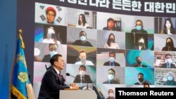 South Korean President Moon Jae-in holds an online New Year news conference in Seoul