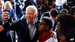Democratic presidential candidate former Vice President Joe Biden meets with attendees during a campaign event, Feb. 26, 2020, Charleston, S.C.