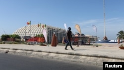 A man is seen walking along a street in Dakar, Senegal, Dec. 19, 2016. 