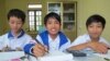 Three school children use books borrowed from one of Thach's parental libraries at An Duc secondary school, Thai Binh province, Vietnam, November 24, 2012. (M. Brown/VOA) 