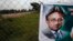 FILE - A poster of former Pakistani President Pervez Musharraf is seen hung up near a checkpoint outside his house, where he has been held under house arrest in Islamabad, Pakistan.