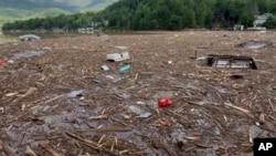 Flood debris from Hurricane Helene floats by in Rutherford County, North Carolina, Sept. 29, 2024. 