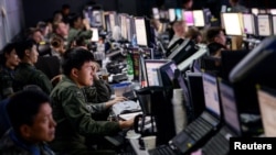 FILE - Members from U.S. and South Korean militaries man the Hardened Theater Air Control Center during the first day of Ulchi Freedom Guardian at Osan Air Base, South Korea, Aug. 17, 2015