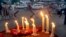 FILE - Lighted candles are seen outside a mosque of the Ahmadi sect, in Lahore, Pakistan, May 30, 2010. Unknown gunmen in central Pakistan on Thursday killed Malik Saleem Latif, a local leader of the Ahmadi community, considered the country’s most persecuted religious sect.
