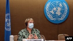 FILE - United Nations High Commissioner for Human Rights Michelle Bachelet looks on after delivering a speech on global human rights developments during a session of the Human Rights Council on June 21, 2021 in Geneva. 