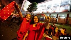 Supporters of Paraguayan presidential candidate Santiago Pena from the ruling Colorado Party celebrate on the streets in Asuncion, Paraguay April 30, 2023.