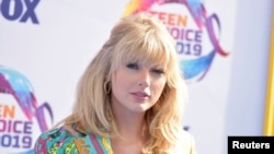 Taylor Swift arrives at the Teen Choice Awards, Aug. 11, 2019, in Hermosa Beach, California.