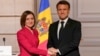 France's President Emmanuel Macron, right, and his Moldovan counterpart Maia Sandu shake hands following a joint press conference and their meeting at the Elysee palace in Paris, on March 10, 2025.