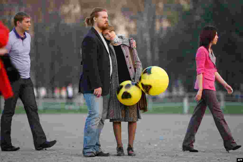 April 26: A couple holds balloons with radioactive signs in Minsk, as they attend a meeting to commemorate Chernobyl victims. Tuesday marked the 25th anniversary of the world's worst civil nuclear accident at the Chernobyl power plant. (REUTERS/Vasily Fed