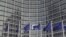 European Union flags are seen outside the European Commission headquarters in Brussels in this October 27, 2010, file photo.