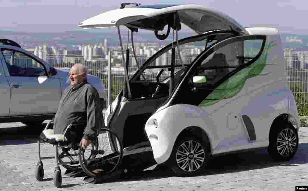 Frantisek Trunda, 67, moves into his Elbee vehicle while seated on a wheelchair in Brno, Czech Republic. The Elbee is a vehicle designed specifically for wheelchair-bound people.&nbsp; It allows them to drive the vehicle without needing to get off their wheelchair or receive assistance from another person.