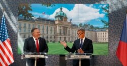 FILE - U.S. Secretary of State Mike Pompeo, left, and the Prime Minister of Czech Republic Andrej Babis address the media during a press conference as part of a meeting in Prague, Czech Republic, Aug. 12, 2020.
