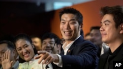 FILE - Future Forward Party leader Thanathorn Juangroongruangkit, center, talks to reporters during a press conference at the party's headquarters in Bangkok, Jan. 21, 2020.