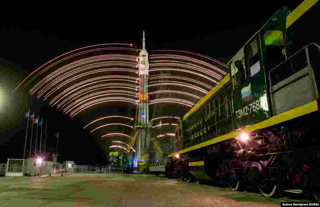 The gantry arms close around the Soyuz TMA-20M spacecraft to secure the rocket, as seen in this long exposure photograph at launch pad 1 at the Baikonur Cosmodrome in Kazakhstan. Launch of the Soyuz rocket is scheduled for March 19 and will carry Expedition 47 Soyuz Commander Alexey Ovchinin of Roscosmos, Flight Engineer Jeff Williams of NASA, and Flight Engineer Oleg Skripochka of Roscosmos into orbit to begin their five and a half month mission on the International Space Station (ISS).