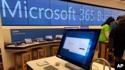 FILE - In this Jan. 28, 2020 file photo a Microsoft computer is among items displayed at a Microsoft store in suburban Boston.