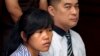 FILE - Philippine national Mary Jane Fiesta Veloso, left, who is on death row for drug offences, accompanied by an unidentified interpreter, attends her judicial review hearing at Sleman District Court in Yogyakarta, Indonesia, March 4, 2015.