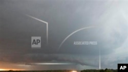 A tornado forms over I-40 as seen looking west from Indian Meridian Road in Midwest City, Okla. on Friday, May 31, 2013. (AP Photo/Alonzo Adams)