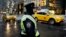 A New York City police officer stands watch outside Trump Tower, Dec. 5, 2016, in New York. 