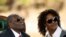 FILE - Zimbabwe's former president Robert Mugabe and his wife Grace look on after addressing a news conference at his private residence nicknamed "Blue Roof" in Harare, Zimbabwe, July 29, 2018. 