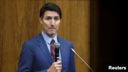 Canada's Prime Minister Justin Trudeau addresses the Liberal party caucus meeting in Ottawa