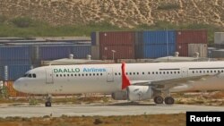 An aircraft belonging to Daallo Airlines is parked at the Aden Abdulle international airport after making an emergency landing following an explosion inside the plane in Somalia's capital Mogadishu, Feb. 3, 2016. 