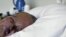 An unidentified man suffering from Alzheimer's disease sleeps all day before passing away in a nursing home in the Netherlands, July 2008. (file photo)