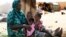 Malian family displaced by war gather at a makeshift camp in Sevare, about 400 miles northeast of Bamako, July 11, 2012.