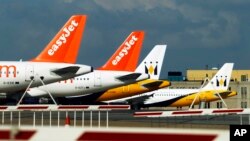 FILE - EasyJet planes are seen standing on the tarmac of Britain's Luton Airport.