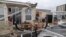  Homeowner Joe Lovece surveys the damage to the kitchen at the back of his oceanfront home after the eye of Hurricane Matthew passed Ormond Beach, Florida, on October 7, 2016. Lovece rode out the storm as waves took away the room at the back of his home. 