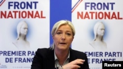 FILE - Marine Le Pen, France's National Front political party head, attends a news conference at the party's headquarters in Nanterre, near Paris, May 27, 2014.