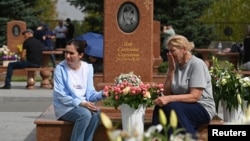 People mourn at a cemetery on the 20th anniversary of the deadly school siege in Beslan in the region of North Ossetia–Alania, Russia Sept. 3, 2024.