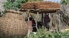 Sorghum, called dura in South Sudan, is dried in a granary in Torit. The government launched a probe into a five-year-old scandal involving bogus sorghum sales.