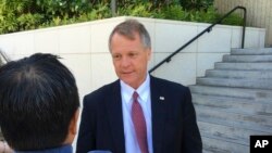 FILE - Birney Bervar speaks with reporters outside the federal courthouse in Honolulu, July 10, 2017. Bervar was appointed the attorney for Ikaika Kang, a 34-year-old active duty soldier who has been accused of trying to aid the Islamic State.