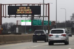 A traffic message board displays a message about coronavirus prevention on Interstate 94 in Chicago on March 28, 2020.