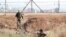 FILE - Israeli soldiers search for two Palestinians who broke out of prison, near Gan Ner, Israel, Sept. 12, 2021. The last two of six escapees were rearrested Sept. 19, the Israeli military said.