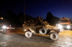An armored vehicle escorts a Turkish military convoy in the border town of Akcakale in Sanliurfa province, Turkey, October 12, 2019. REUTERS/Murad Sezer