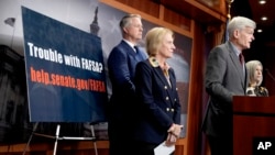 Sen. Bill Cassidy, R-La., speaks during a news conference on problems with the FAFSA rollout, Feb. 1, 2024, on Capitol Hill in Washington. Looking on from left are Sen. Roger Marshall, R-Kan., and Sen. Shelley Moore Capito, R-W.Va. 