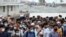 People crowd a ferry terminal to leave the city ahead of a lockdown set to start on July 1, at the Shimulia ferry terminal in Munshiganj, on the outskirts of Dhaka, Bangladesh, June 30, 2021. 